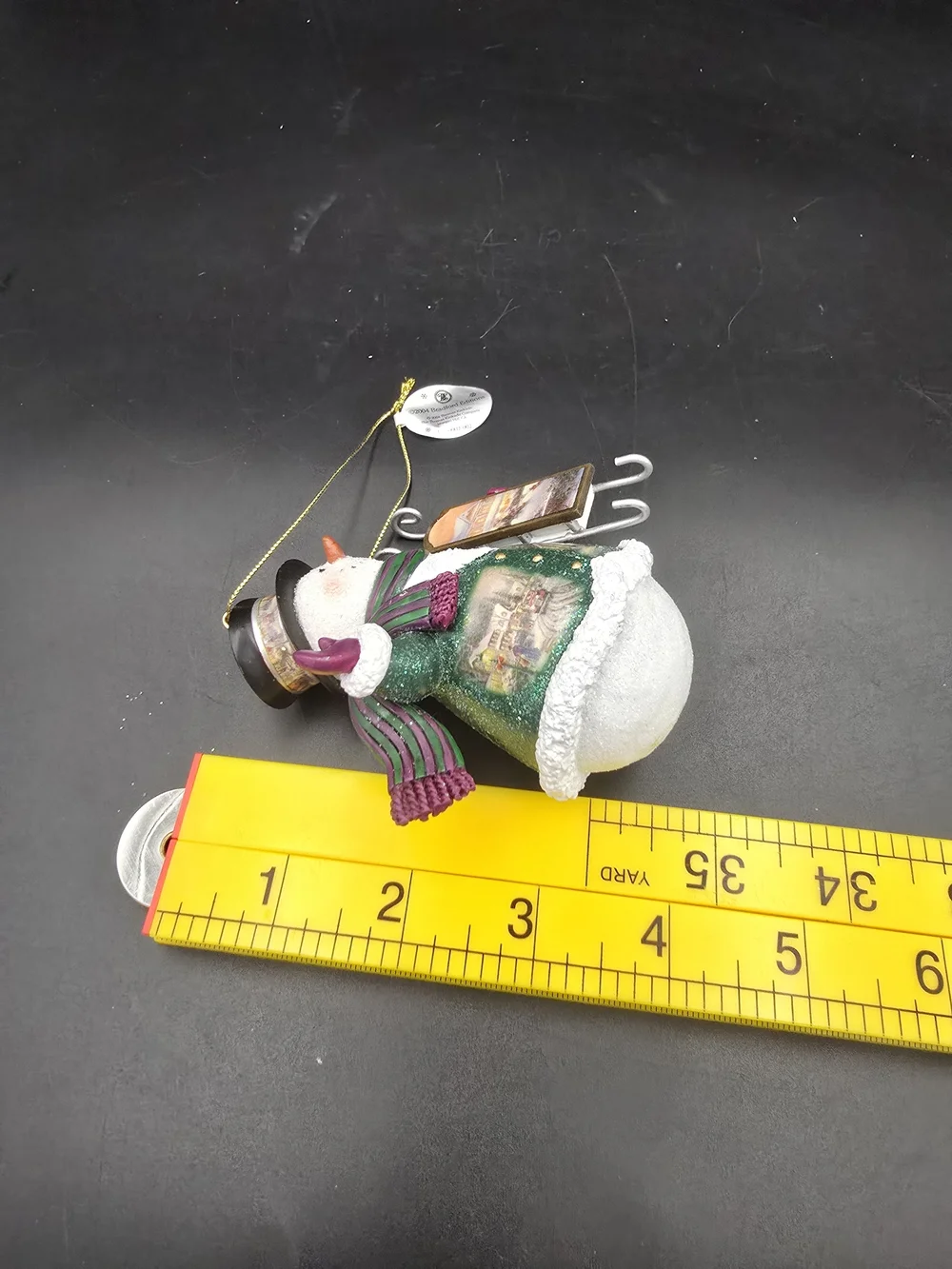 Thomas Kinkade Green and White Snowman Ornament with Purple Accents